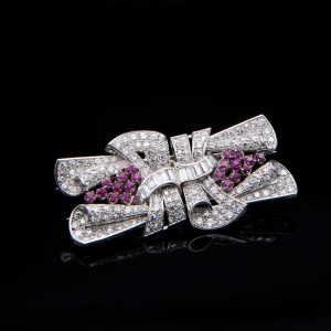 Lot 082 Double clip-brooch in platinum and gold with diamonds and rubies