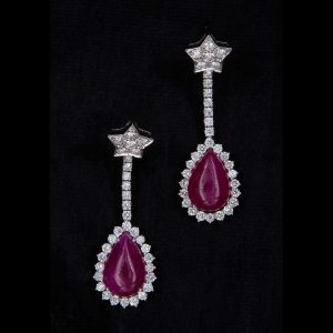 Lot 083 Dangling earrings with a star, made of white gold, diamonds and rubies