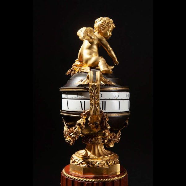 Lot 062 - Important l'heure tournant marble and gilt bronze clock, early 19th century