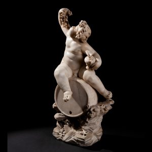 Lot 095 - Sculpture of a Bacchic putto on a barrel, 17th century