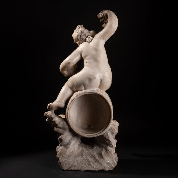 Lot 095 - Sculpture of a Bacchic putto on a barrel, 17th century